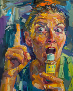 Mocking, hysterical person holding up a bottle of B12 and pointing with a finger.