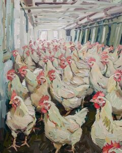 Crowded chickens in a warehouse.