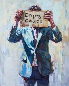 Man in a suit holding a protest sign saying "Empty Cages"